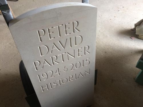 A headstone in the workshop ready for it's final clean up.